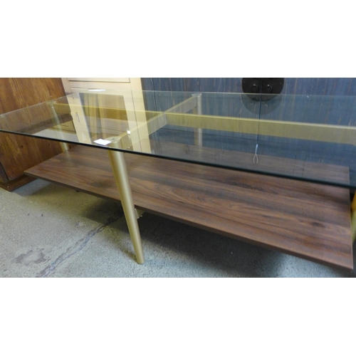 1776 - A glass topped coffee table * This lot is subject to VAT