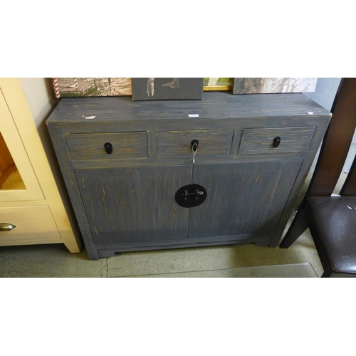 1777 - A grey painted weathered effect three drawer two door sideboard * this lot is subject to VAT