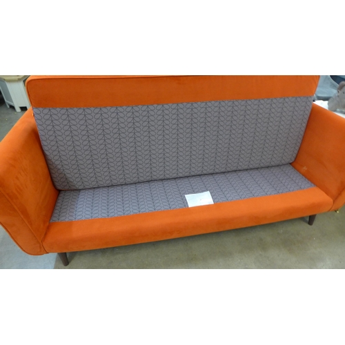 1301 - A designer orange velvet upholstered three seater sofa - Ex display