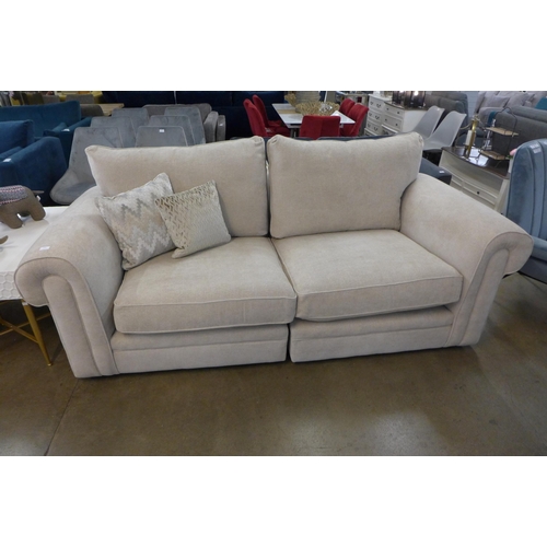 1307 - A designer natural weave three seater sofa