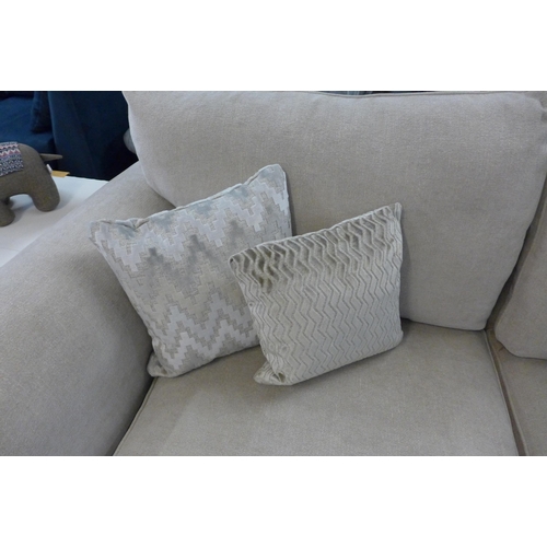 1307 - A designer natural weave three seater sofa