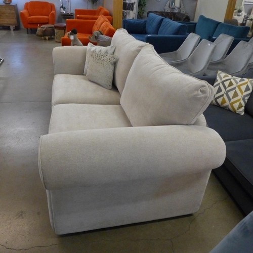 1307 - A designer natural weave three seater sofa