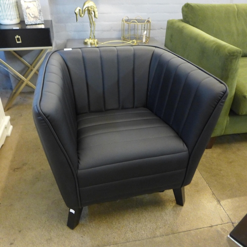 1350 - A Delph black upholstered tub chair