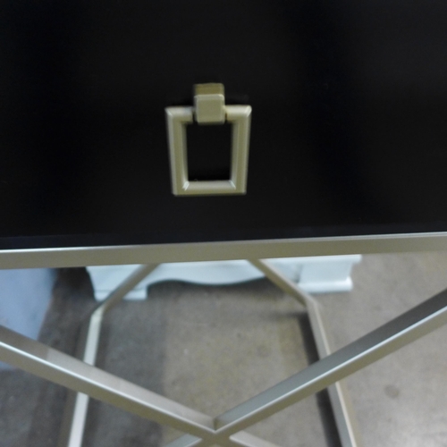 1355 - A Black single drawer bedside chest with gold cross legs (marked)