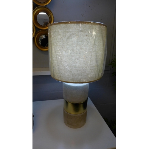 1362 - A concrete base table lamp with a decorative gold band and linen shade, H 63cms (70316743)   #