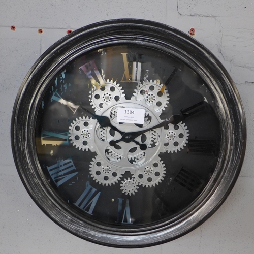 1384 - A black circular moving gears wall clock