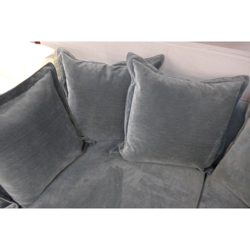 1388 - A designer blue weave velvet, curved back three seater sofa