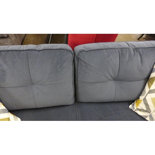 1398 - A designer anthracite velvet upholstered three seater sofa