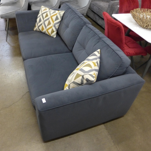 1398 - A designer anthracite velvet upholstered three seater sofa