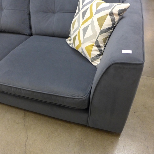 1398 - A designer anthracite velvet upholstered three seater sofa