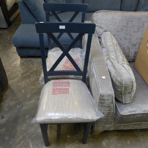 1551 - A pair of blue painted and upholstered cross back dining chairs