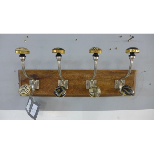 1377 - A rack of four coat hooks with ceramic knobs (HH563916)   #