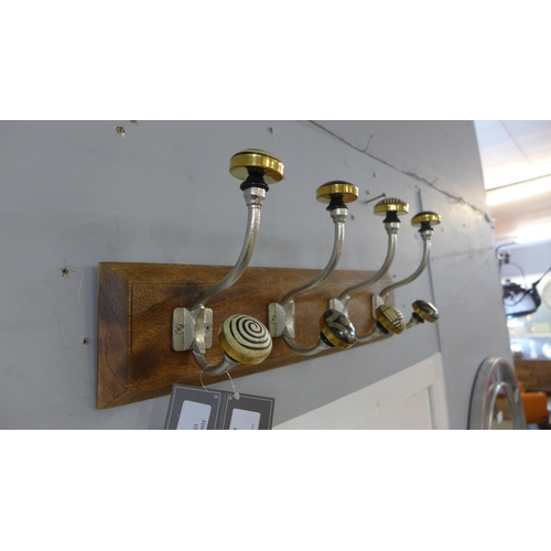 1377 - A rack of four coat hooks with ceramic knobs (HH563916)   #