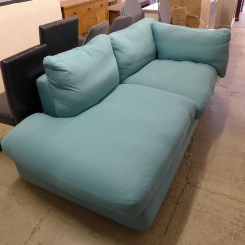 1749 - A turquoise upholstered corner sofa/chaise, slight damage to back