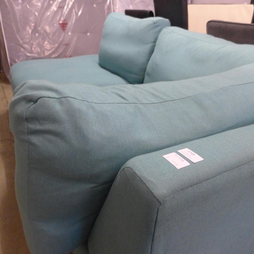 1749 - A turquoise upholstered corner sofa/chaise, slight damage to back