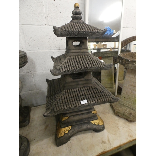 2421 - A Pagoda garden ornament with golden details, approx 1m tall