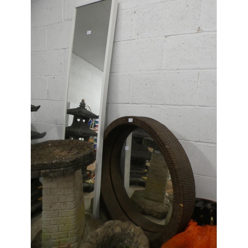 2423 - Two large mirrors: one deep circular with wicker frame and one full length with white wooden frame