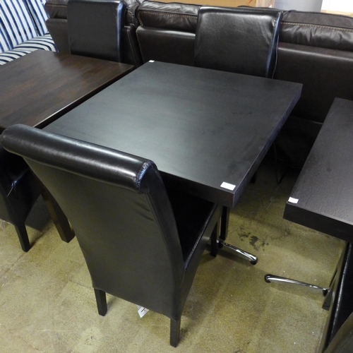 1994 - A square dining table with metal legs and two leather effect chairs