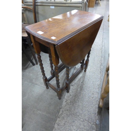 214 - A small oak barleytwist gateleg table