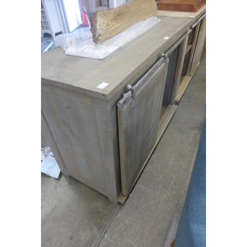 1584 - A rustic timber sideboard with wine rack *This lot is subject to VAT