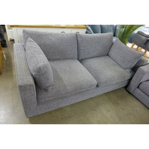 1334 - A grey patterned pair of three seater sofas and armchair