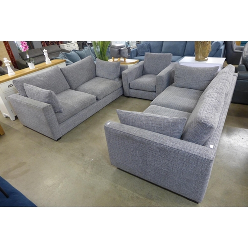 1334 - A grey patterned pair of three seater sofas and armchair