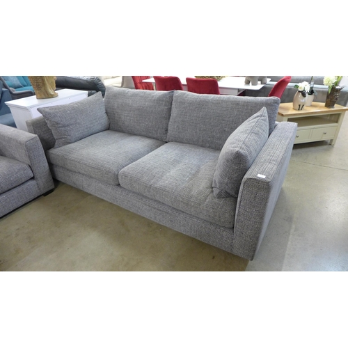 1334 - A grey patterned pair of three seater sofas and armchair