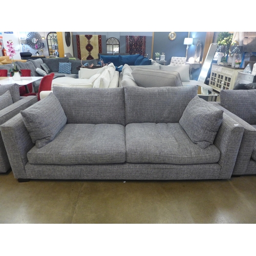 1334 - A grey patterned pair of three seater sofas and armchair