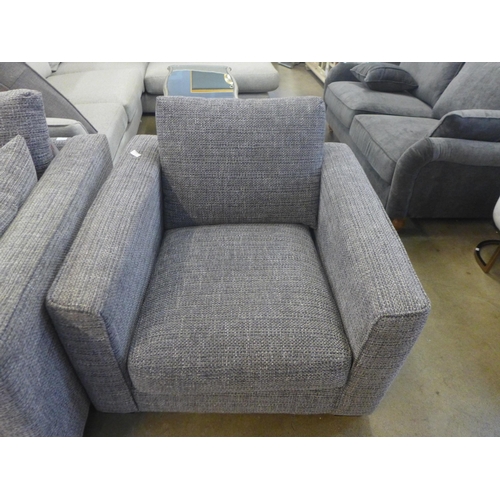 1334 - A grey patterned pair of three seater sofas and armchair