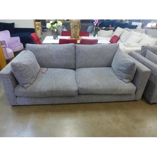 1334 - A grey patterned pair of three seater sofas and armchair