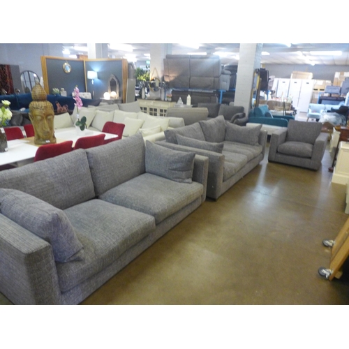 1334 - A grey patterned pair of three seater sofas and armchair