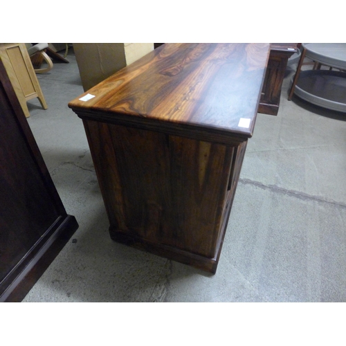 1339 - An Indian hardwood TV stand *This lot is subject to VAT