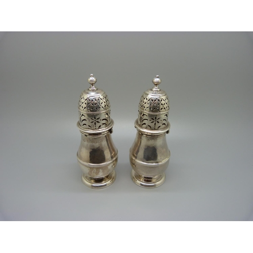 893 - A pair of early 18th Century silver sugar shakers, London mark, 227g, 14cm