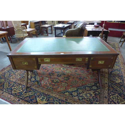 49 - A mahogany, brass mounted and green leather topped military/campaign style desk