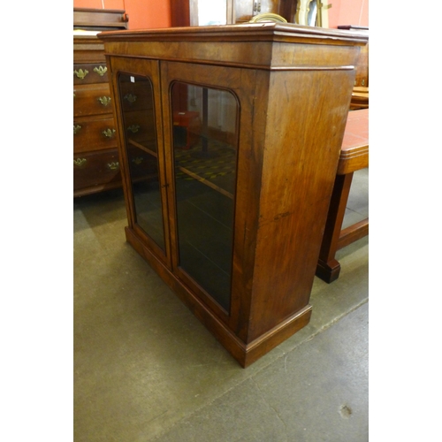 134 - A Victorian walnut two door bookcase