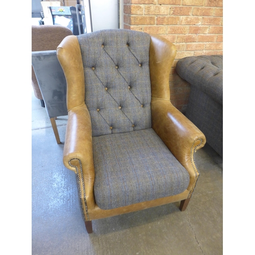 1329 - A Chester Harris Tweed and Cerato leather wing back  armchair - small cut in leather as per photogra... 