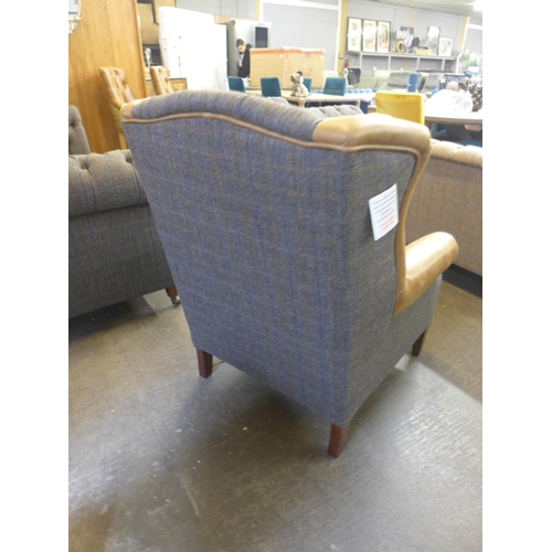 1329 - A Chester Harris Tweed and Cerato leather wing back  armchair - small cut in leather as per photogra... 