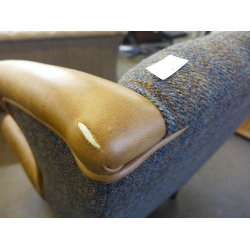 1329 - A Chester Harris Tweed and Cerato leather wing back  armchair - small cut in leather as per photogra... 