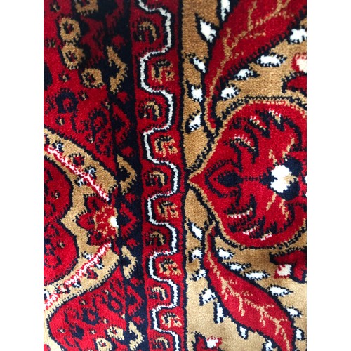 1433 - A full pile red ground Turkish runner, length 300cm