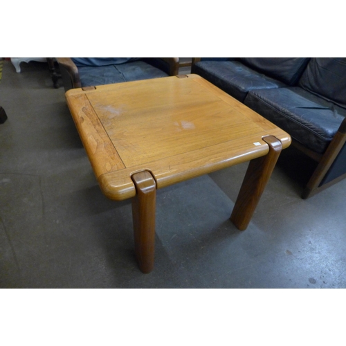 103 - A Danish Dyrlund teak and blue leather settee, armchair and a coffee table