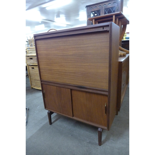 108 - A teak writing cabinet