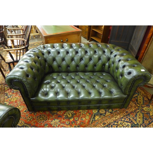 12 - A green leather Chesterfield settee and matching club chair