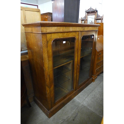 134 - A Victorian walnut two door bookcase