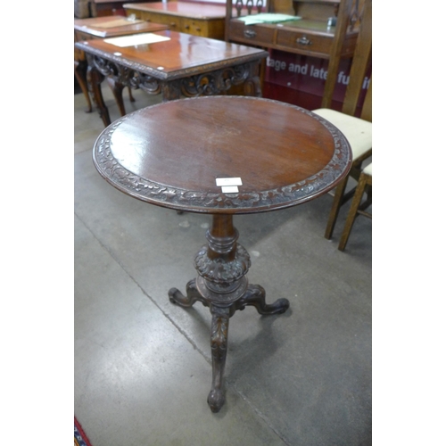 20 - A Victorian carved mahogany carved walnut tripod table