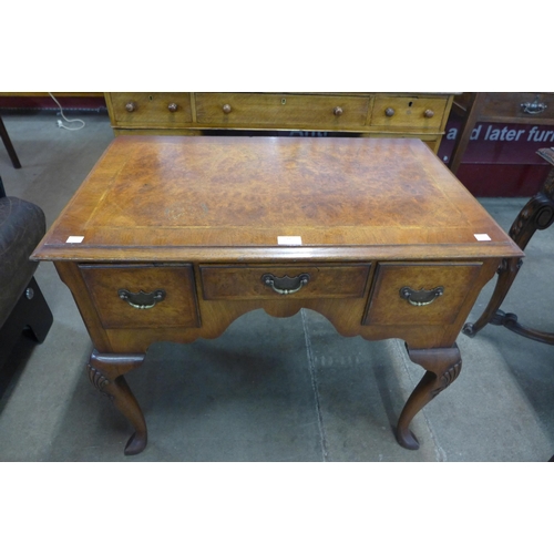 22 - A George III style inlaid burr walnut lowboy