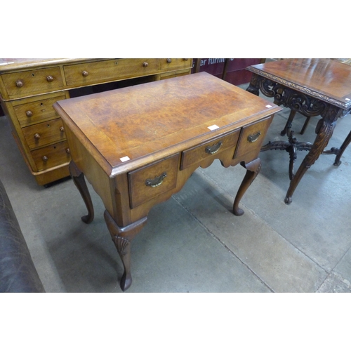 22 - A George III style inlaid burr walnut lowboy