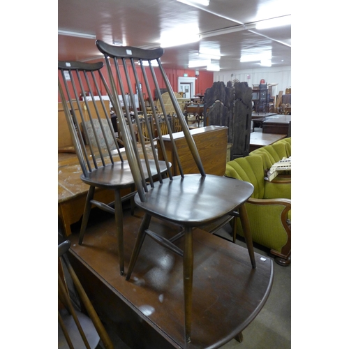 220 - A set of four Ercol dark elm and beech Goldsmith chairs and a drop leaf table