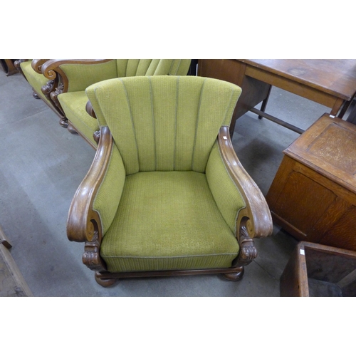 224 - A set of three Art Deco carved oak and green fabric upholstered club chairs