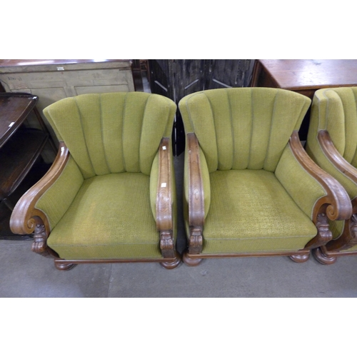 224 - A set of three Art Deco carved oak and green fabric upholstered club chairs