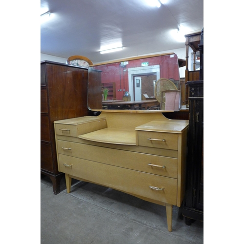 243 - A light oak dressing table